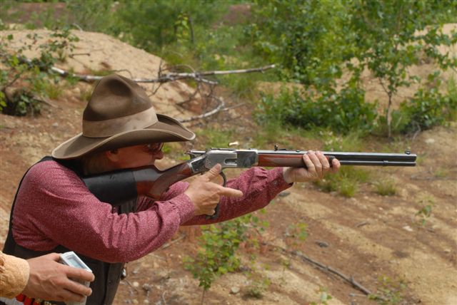 Rowdy Bill shooting rifle.