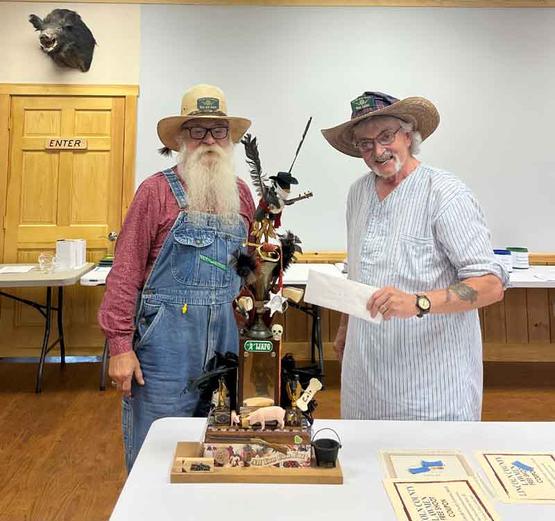 Order of the Crow.  Wheat Lightnin' awarding it to Black Jack Daniels.